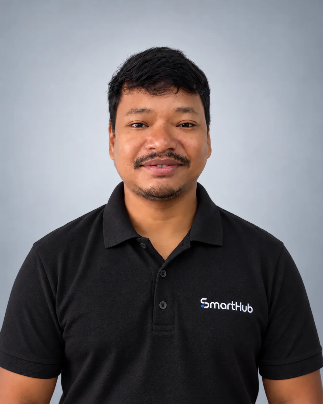 Portrait of Mrinal Ray wearing a black SmartHub polo