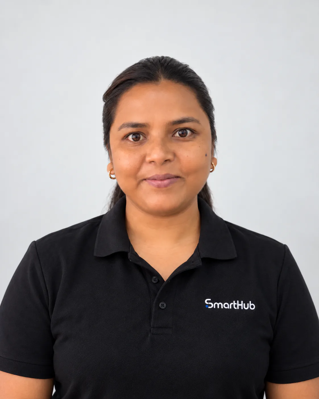 Portrait of Sudha Darjee wearing a black SmartHub polo